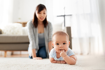 Image showing sweet little asian baby boy with mother at home