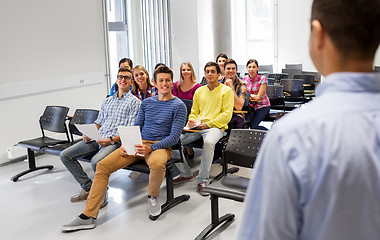 Image showing group of students and teacher at lecture hall