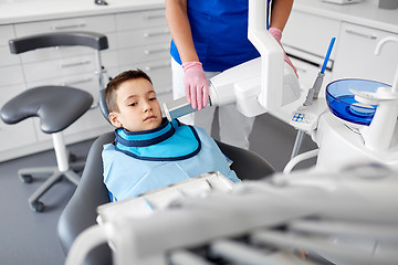 Image showing dentist making x-ray of kid teeth at dental clinic