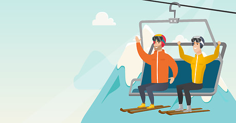 Image showing Two caucasian skiers using cableway at ski resort.