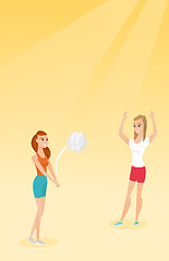 Image showing Two caucasian women playing beach volleyball.