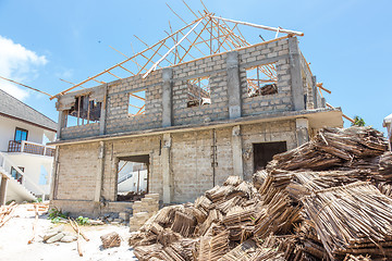 Image showing Construction site of traditional roof thatching in Africa. Developing of traditional tached roof civil engineering