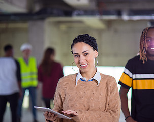 Image showing multiethnic business people in group, architect and engineer on 