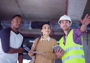 Image showing multiethnic business people,architect and engineer on constructi