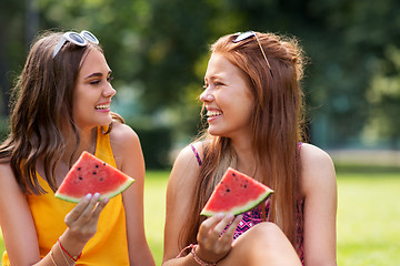 Image showing teenage girls eating watermelon at picnic in park