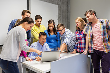 Image showing students and teacher with laptop at school