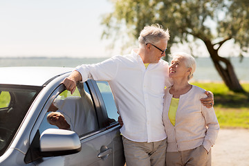 Image showing happy senior couple with car in summer