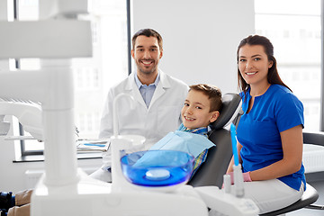 Image showing dentists and kid patient at dental clinic