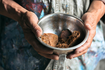 Image showing Male beggar hands seeking food or money at public path way