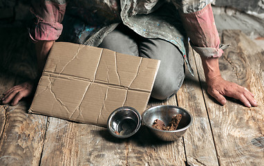 Image showing Male beggar hands seeking food or money at public path way