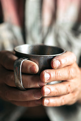 Image showing Male beggar hands seeking food or money at public path way