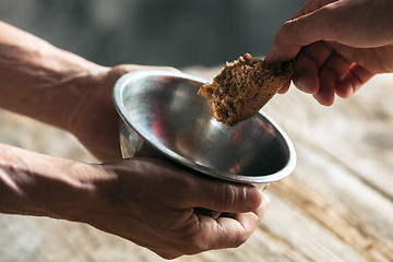 Image showing Male beggar hands seeking food or money at public path way