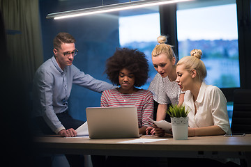 Image showing Multiethnic startup business team in night office