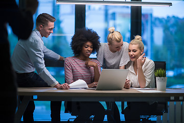 Image showing Multiethnic startup business team in night office