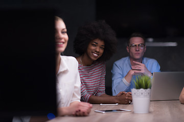 Image showing Multiethnic startup business team in night office