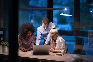 Image showing Multiethnic startup business team in night office