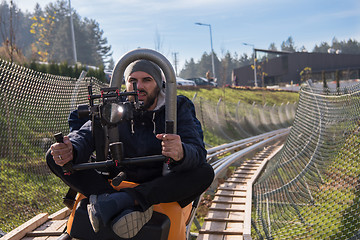 Image showing videographer at work on alpine coaster