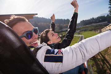 Image showing couple enjoys driving on alpine coaster