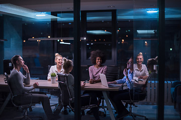 Image showing Multiethnic startup business team in night office