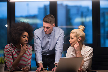 Image showing Multiethnic startup business team in night office