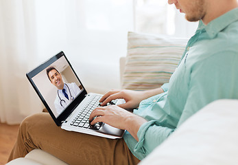 Image showing patient having video call with doctor on laptop