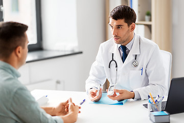 Image showing doctor with glucometer and patient at hospital