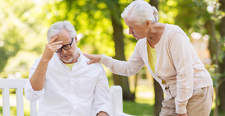 Image showing senior man suffering from headache outdoors