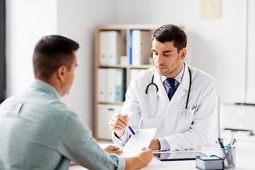 Image showing doctor showing prescription to patient at hospital