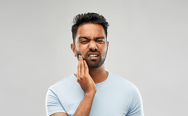 Image showing indian man suffering from toothache