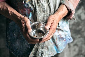 Image showing Male beggar hands seeking food or money at public path way