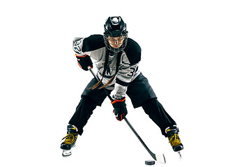 Image showing Young female hockey player with the stick isolated on white background