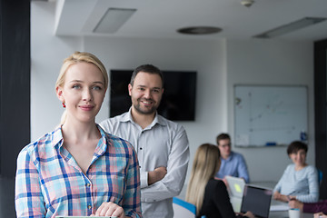 Image showing Business People Working With Tablet in startup office