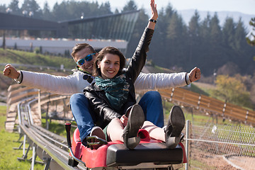 Image showing couple enjoys driving on alpine coaster