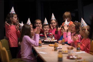 Image showing The young boy joyfully celebrating his birthday