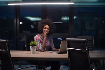 Image showing black businesswoman using a laptop in startup office