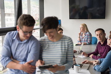 Image showing Two Business People Working With Tablet in office