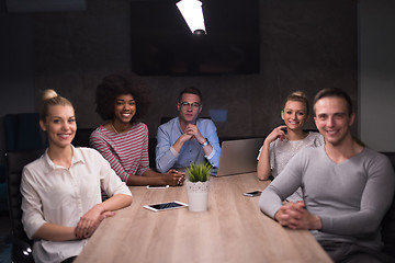 Image showing Multiethnic startup business team in night office