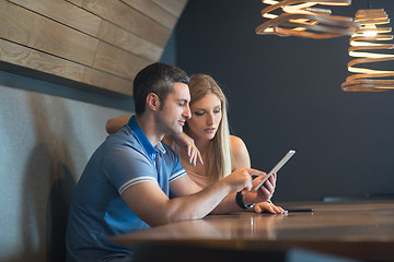 Image showing couple using tablet at home