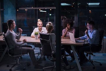 Image showing Multiethnic startup business team in night office