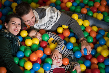 Image showing young parents with kids in a children\'s playroom