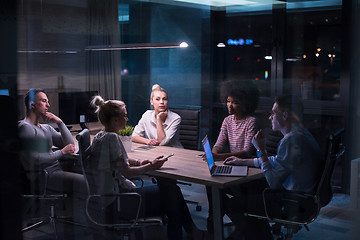 Image showing Multiethnic startup business team in night office