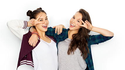 Image showing happy teenage girls hugging and showing peace sign