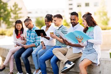 Image showing international students with notebooks outdoors