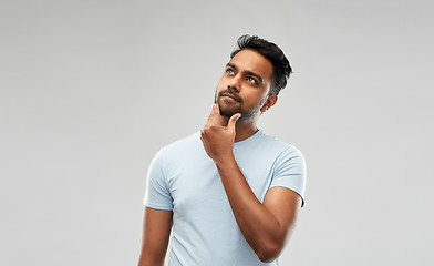 Image showing indian man thinking and looking up