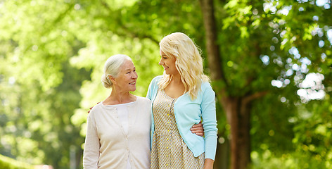 Image showing daughter with senior mother hugging at park