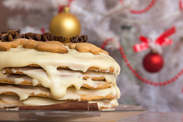Image showing Homemade cake with condensed milk, on the background of the Christmas tree