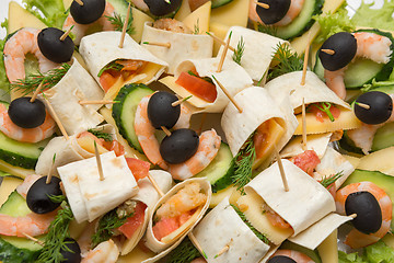 Image showing Konope snack on skewers, salad, cheese, shrimp and olive