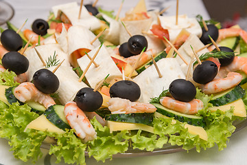 Image showing Konope snack on skewers, salad, cheese, shrimp and olive