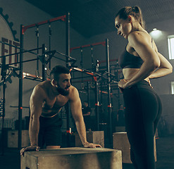 Image showing Man during exercises in the fitness gym.