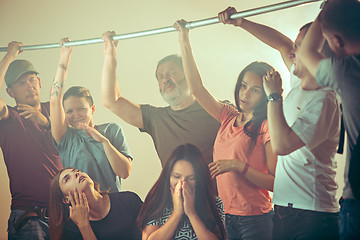 Image showing Sweaty armpits. Sweaty man. Bus. Public transport. The unhappy people near man